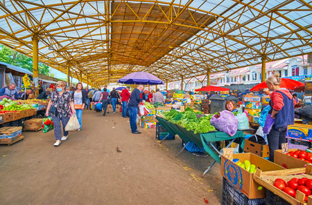 ODESSA, UKRAINE - June 18, 2021: The local farmers sell fresh vegetables and fruits in Pryvoz Market, on June 18 in Odessaのeditorial素材