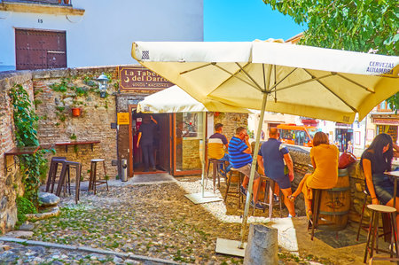 GRANADA, SPAIN - SEPTEMBER 27, 2019: The small outdoor terrace of the tavern, located at the Espinosa Bridge, on September 27 in Granadaのeditorial素材