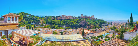 Panorama of Alhambra atop the Sabika Hill, Generalife gardens and North Pavilion atop the Hill of Sun and the Albaicin neighborhood roofs in the foreground, Granada, Spainのeditorial素材