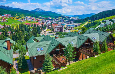 The modern houses of the famous Ukrainian Bukovel mountain resort, located in Gorgany Mountain Range, Carpathians, Ukraineの写真素材
