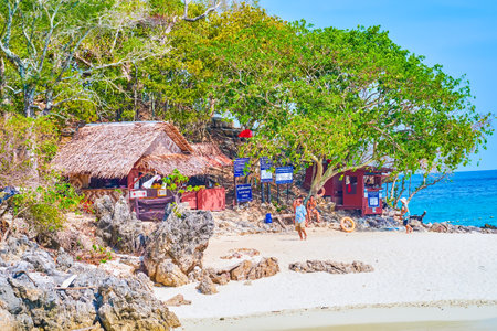 AO NANG, THAILAND - APRIL 26, 2019: The small bar with thatched roof on the beach of Koh Tup island, on April 26 in Ao Nangのeditorial素材