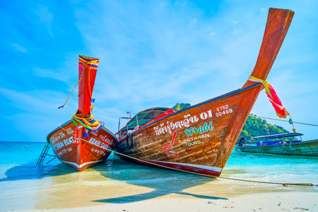 Thai wooden longtail boats are a popular tourist transport, using for short sea trips around neighbour islands, Ko Mor in Krabi region, Thailandのeditorial素材