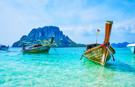AO NANG, THAILAND - APRIL 26, 2019: The traditional Thai longtail boat moored on the beach of Koh Mor island, on April 26 in Ao Nangのeditorial素材