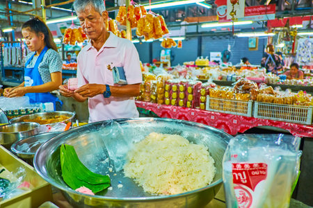 CHIANG MAI, THAILAND - MAY 4, 2019: A big bowl of sticky rice on the counter of Gate Market stall, on May 4 in Chiang Maiのeditorial素材