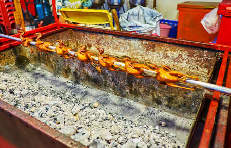 Rotisserie quails in Saturday Night Market, Wualai walking street, Chiang Mai, Thailandの写真素材