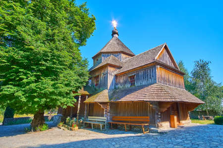 The wooden church of Exaltation of Holy Crossis one of the main landmarks, located in Smotrych River Canyon of Kamianets-Podilskyi, Ukraineの写真素材