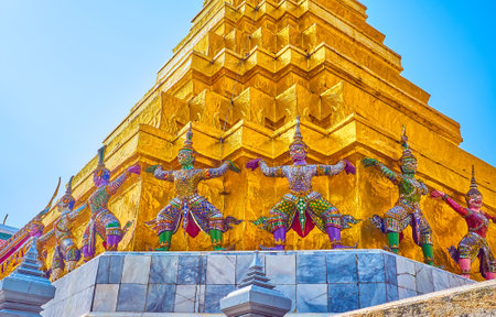 BANGKOK, THAILAND - MAY 12, 2019: The sculptures of Yakshas (Giants) around the base of golden Phra Suvarnachedi in Grand Palace complex, on May 12 in Bangkok, Thailandのeditorial素材