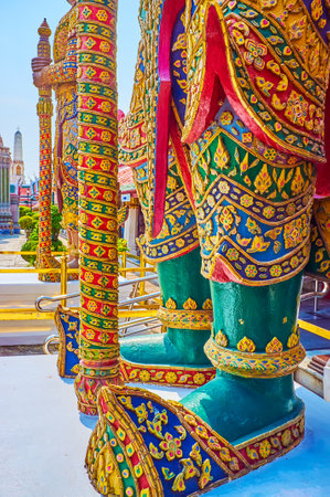 BANGKOK, THAILAND - MAY 12, 2019: The legs of the giant Guardian (Yaksha) decorated with floral elements, Grand Palace, on May 12 in Bangkok, Thailandのeditorial素材