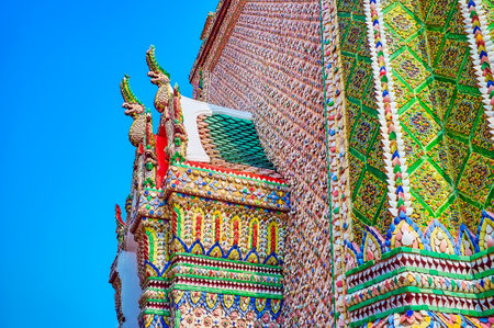 Ceramic tiles decoration of the facade of Ho Rakhang in typic Thai style with Nagas on ceilings, Grand Palace of Bangkok, Thailandのeditorial素材