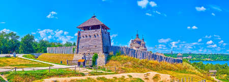 Panorama of Zaporizhian Sich Fort scansen with tall stakewall (palisade), towers, St Nicholas...