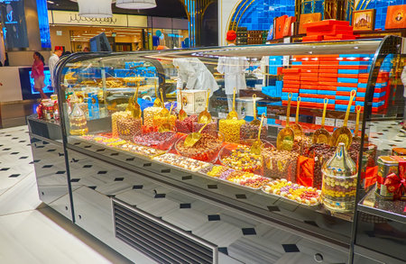 DUBAI, UAE - MARCH 7, 2020: The showcase of Hafiz Mustafa Turkish pastry-shop with wide range of candies, dry fruits and nuts in chocolate, Dubai Mall, on March 7 in Dubaiのeditorial素材