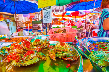Stuffed crabs and pickled seafood in cafe of outdoor Sampheng Market in Chinatown, Bangkok, Thailandのeditorial素材