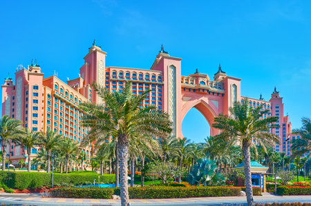 Panorama of the outstanding Atlantis The Palm complex, decorated with large horseshoe arch and small towers, surrounded with palm garden, Palm Jumeirah, Dubai, UAEのeditorial素材