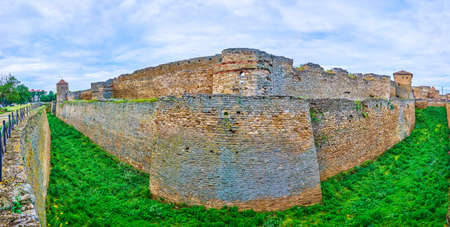 Panoramic view of the outer walls, towers and a deep dug moat of historic Akkerman Fortress,...