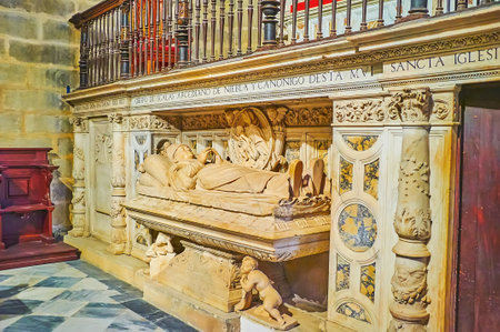 SEVILLE, SPAIN - SEPT 29, 2019: The Gothic tomb of Obispo de Scalas in Capilla de Scalas of Seville Cathedral with sculptures, stone inlay and Latin inscriptions, on Sept 29 in Sevilleのeditorial素材