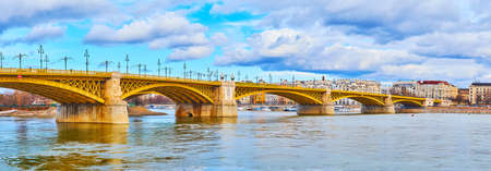 Panorama of beautiful Margaret Bridge (Margit Hid) across Danube River with yellow metal connecting sections, Budapest, Hungaryの写真素材