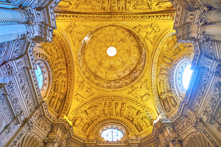 SEVILLE, SPAIN - SEPTEMBER 29, 2019: The outstanding carved dome of Great Sacristy of Seville Cathedral with intricate ornaments and sculptures, on September 29 in Sevilleのeditorial素材