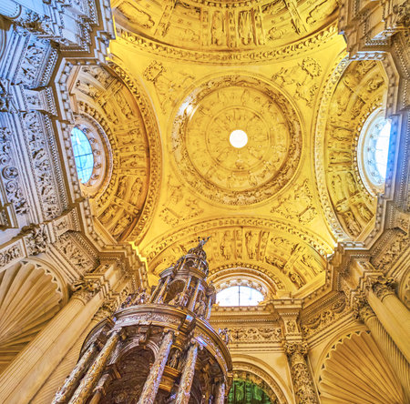 SEVILLE, SPAIN - SEPTEMBER 29, 2019: The carved dome of the Main Sacristy (Sacristia Mayor) of Seville Cathedral with fine wall sculptures and ornaments, on September 29 in Sevilleのeditorial素材