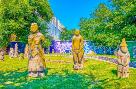 DNIPRO, UKRAINE - AUGUST 24, 2021: The stone Babas of Kurgan Stelae, the anthropomorphic stone stelae in the park next to National Historical Museum, on August 24 in Dnipro, Ukraineのeditorial素材
