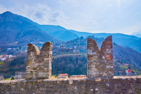 The medieval stone battlements on the wall of Castlegrande fortress, Bellinzona, Switzerlandのeditorial素材