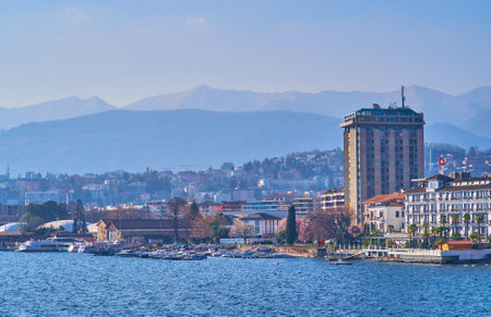 The shore of Lugano Lake with small marina and hotels of Lugano city, Switzerlandのeditorial素材