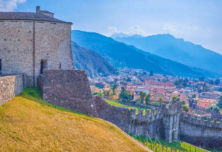 The medieval fortress Castelgrande with its walls in the middle of Bellinzona city in Switzerlandの写真素材