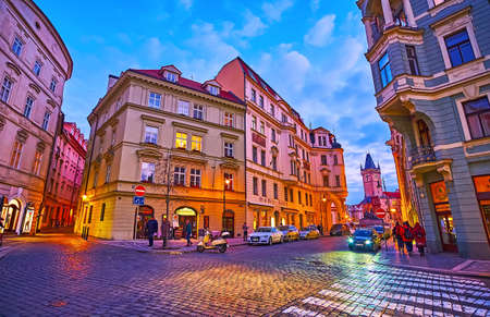 PRAGUE, CZECH REPUBLIC - MARCH 5, 2022: The evening old town cityscape from Dlouha Street with a view on old houses and Old Town Hall tower in background, on March 5 in Pragueのeditorial素材