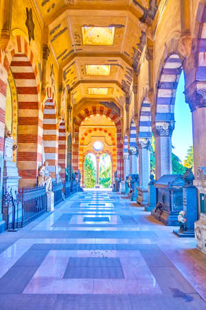 MILAN, ITALY - APRIL 5, 2022: Walk along the loggia of Famedio in Memorial Cemetery, on April 5 in Milan, Italyのeditorial素材