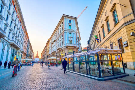 MILAN, ITALY - APRIL 5, 2022: The large and wide Via Dante street is the most popular walking...