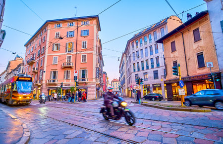 MILAN, ITALY - APRIL 5, 2022: The bike rides along via Meravigli street in late evening time, on April 5 in Milan, Italyのeditorial素材