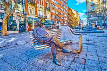 BUDAPEST, HUNGARY - FEBRUARY 23, 2022: The statue to Imre Kalman sitting on the banch on Nagymezo Street, on February 23 in Budapest, Hungaryのeditorial素材