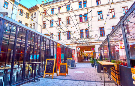 BUDAPEST, HUNGARY - FEBRUARY 23, 2022: The lines of restaurants and clubs of Gozsdu Courtyard, , on February 23 in Budapest, Hungaryのeditorial素材