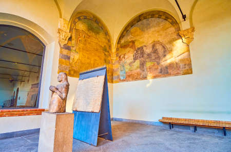 MILAN, ITALY - APRIL 5, 2022: The covered gallery of Dukes residence with medieval sculpture and preserved frescoes, Sforza's Castle, on April 5 in Milan, Italyのeditorial素材