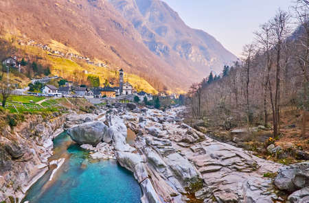 The beautiful rocky landscape of Verzasca River bed, surrounded with Lepontine Alps and small houses of Lavertezzo, Valle Verzasca, Switzerlandの写真素材