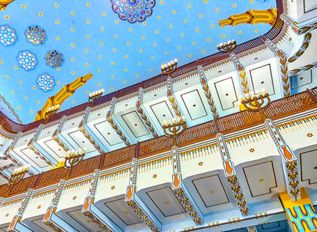 BUDAPEST, HUNGARY - FEBRUARY 23, 2022: The two-storey women's galleries with chandeliers in form of menorah in Kazinczy Street Synagogue, on February 23 in Budapest, Hungaryのeditorial素材