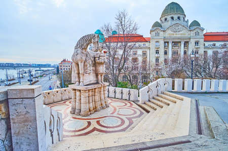 BUDAPEST, HUNGARY - FEB 27, 2022: Gellert Hill viewing terrace with monument to St Stephen and the facade of Gellert Hotel and Baths, on Feb 27 in Budapestのeditorial素材