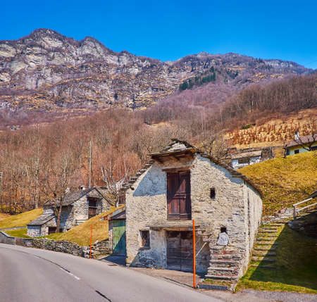 The old stone houses on the mountain slope in Frasco village, Valle Verzasca, Switzerlandの写真素材