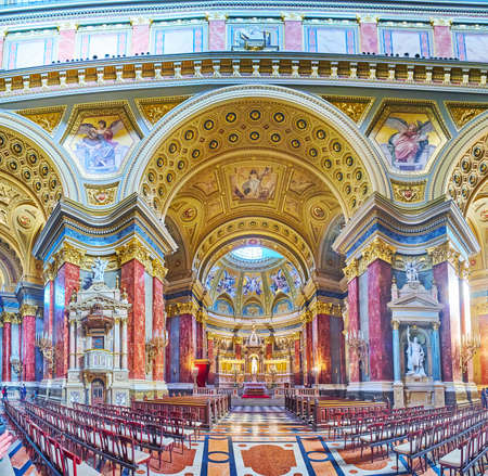 BUDAPEST, HUNGARY - FEB 27, 2022: Panorama of St Stephen Cathedral with Sanctuary, richly decorated with sculptures, mosaics, carvings, on Feb 27 in Budapestのeditorial素材