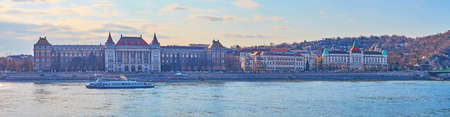 Panorama of Muegyetem Embankment of Danube River with buildings of Corvinus University and Gellert Thermal Baths and Hotel, Budapest, Hungaryの写真素材