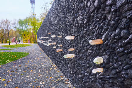 KYIV, UKRAINE - OCT 10, 2021: Explore the Crystal Wall of Wailing in Babyn Yar (Babi Yar) Holocaust Memorial Center, created of black coal and crystals of quartz, on Oct 10 in Kyivのeditorial素材