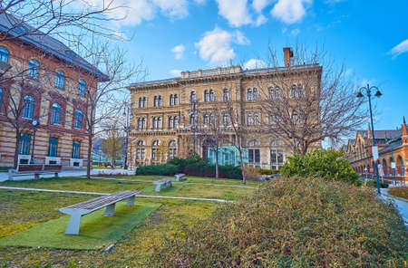 The scenic green park in front of two buildings of Corvinus University, on Fovam Square, Budapest, Hungaryのeditorial素材