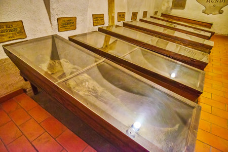 BRNO, CZECH REPUBLIC - MARCH 10, 2022: The lines of modest coffins with mummified deceased brothers...