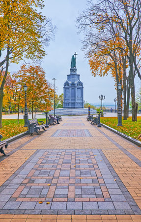 Pedestrian alley in front of Prince Volodymyr Monument in St Volodymyr Hill park with yellow autumn trees, Kyiv, Ukraineのeditorial素材