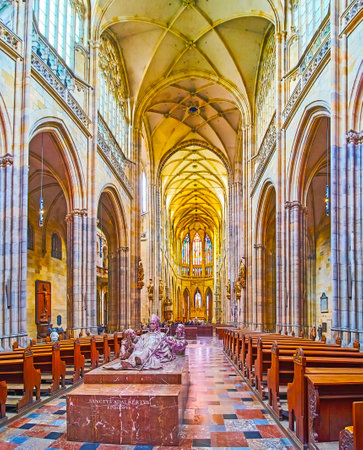 PRAGUE, CAZECH REPUBLIC - MARCH 6, 2022: Historic St Vitus Cathedral interior with stone carved decors and statue of St Adalbert, on March 6 in Pragueのeditorial素材