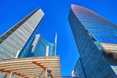 MILAN, ITALY - APRIL 9, 2022: Modern glass skyscrapers of commercial center on Gae Aulenti Square,...