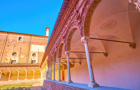Walk along the covered gallery with arcades of small cloister of Certosa di Pavia monastery, Italyのeditorial素材