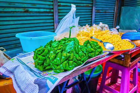 BANGKOK, THAILAND - APRIL 23, 2019: Food in banana wraps in Sampeng Lane Market, on April 23 in Bangkok, Thailandのeditorial素材