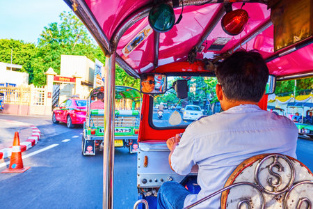 BANGKOK, THAILAND - APRIL 23, 2019: Tuk tuk ride in old town streets on busy roads, on April 23 in Bangkokのeditorial素材