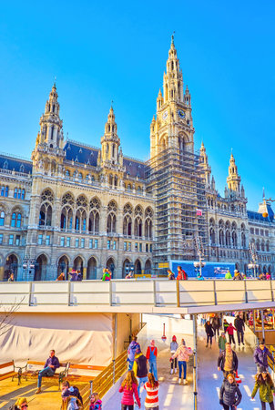 VIENNA, AUSTRIA - FEBRUARY 17, 2019: Large urban skating rink on Rathausplatz at the Viennese City Hall, on February 17 in Vienna, Austriaのeditorial素材