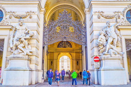 VIENNA, AUSTRIA - FEBRUARY 17, 2019: The sculptures of Heracles groups at the entrance to passage in Michael's wing of Hofgurg Palace, on February 17 in Vienna, Austriaのeditorial素材